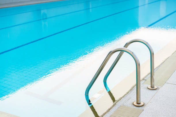 istock Indoor swimming pool with stair in a building 825404738