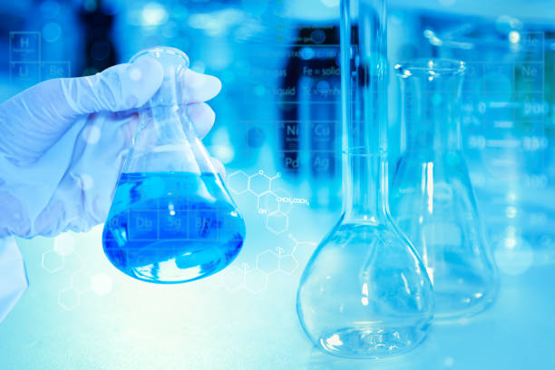 istock scientist with equipment and science experiments ,Laboratory glassware containing chemical liquid, science research,science background and science concept. 825410174