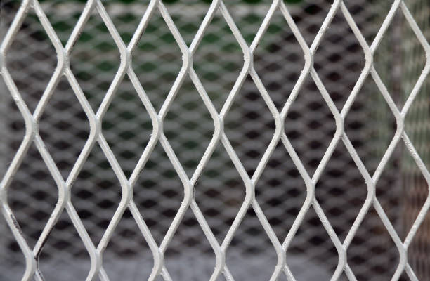 istock Square diagonal pattern of metal cage. pattern of Steel grating. 825412566