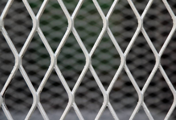 istock Square diagonal pattern of metal cage. pattern of Steel grating. 825412576