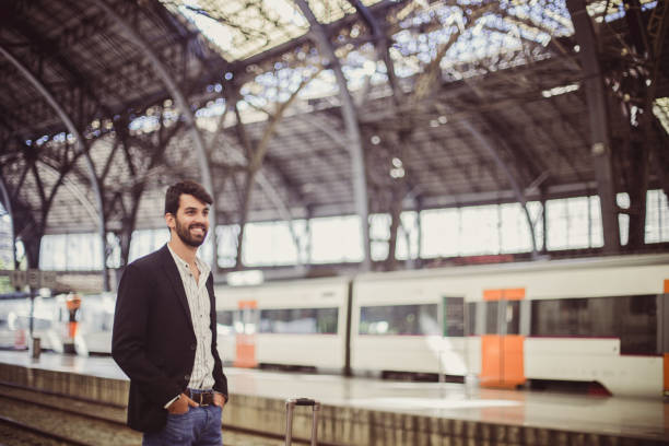 istock Gentleman waiting on train station 825412918
