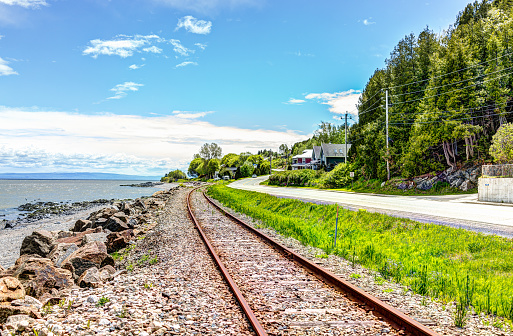 Railroad with Saint Lawrence river in Saint-Irenee, Quebec, Canada in Charlevoix region