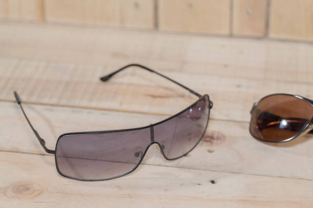 istock sun glasses on wooden board plank 825416862