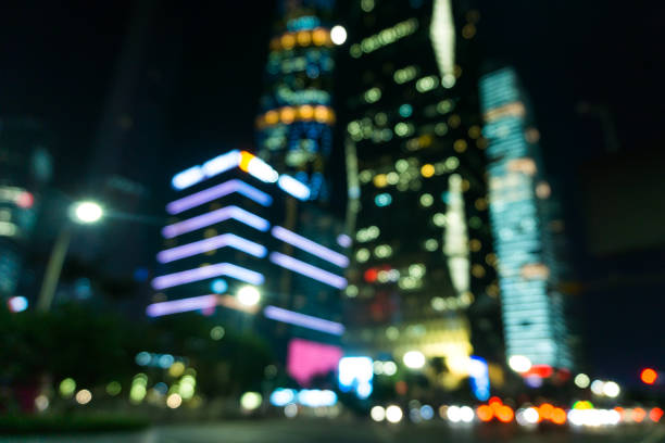 Blurred city lights and office buildings