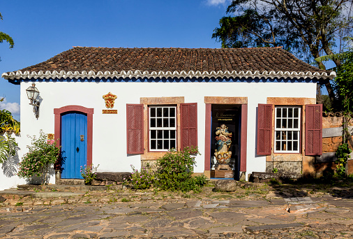 Tiradentes, Minas Gerais, May 3, 2013. The Colonial houses and imperfect rock pavement of Tiradentes city are the trademark of this vintage village, a National Heritage place, full of small shops and restaurants.