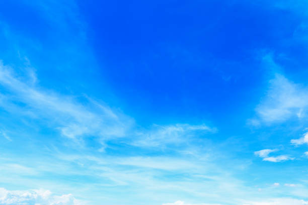 istock beautiful soft white clouds on blue sky for background and design 825420636