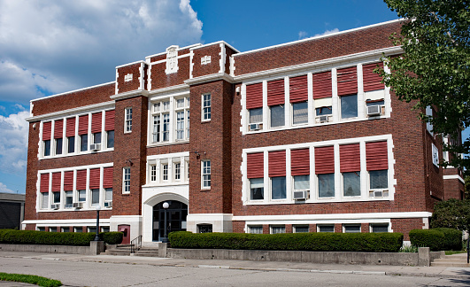 Stately, old, red brick school building built in the 1930`s.