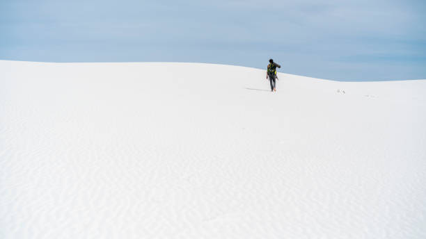 istock The young man, traveller, backpacker, exploring the White Sands National Monument, New Mexico 825431352