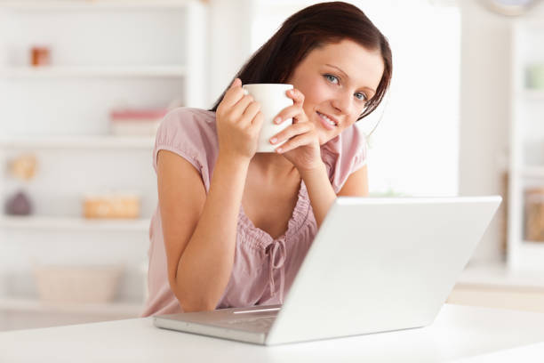 istock Woman with cup of coffe and notebook 825431484
