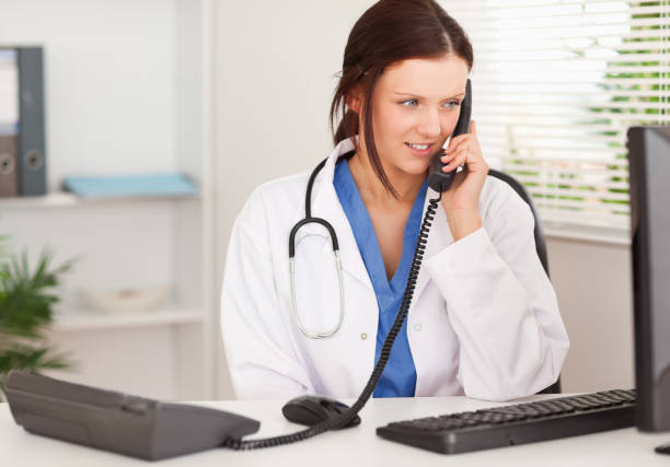 istock Female doctor telephoning in office 825431718