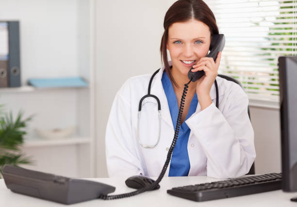istock Female doctor telephoning 825431748