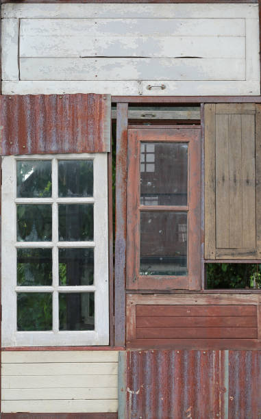 istock Abstract old wooden windows with zinc on the wall. 825432076