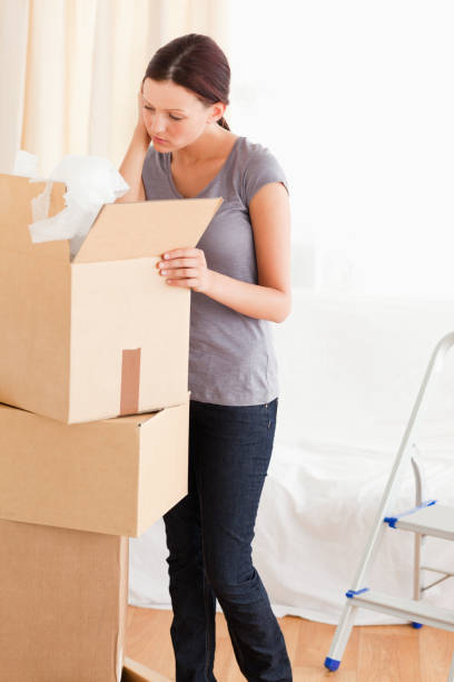 istock Woman searching in a cardboard 825442830