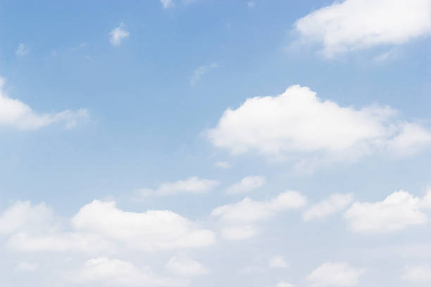 istock Soft white clouds against blue sky background and empty space for your design 825443020
