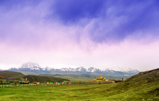 Mountain landscape with tibetan monastery by Tagong grassland in China View on tradtitional tibetan monastery by Tagong grassland in China colorado flag art pictures stock pictures, royalty-free photos & images