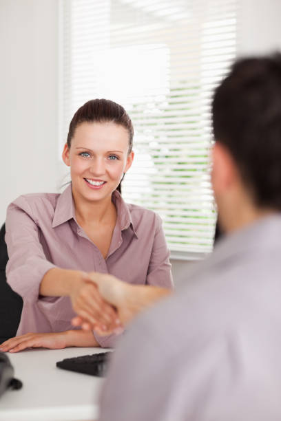 istock Businesswoman shakes hands with a man 825443178