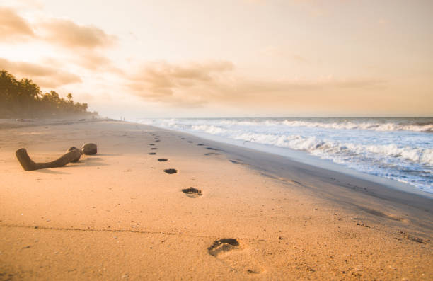 Photo of Foodsteps and sunset on the beach by Tayrona in Colombia