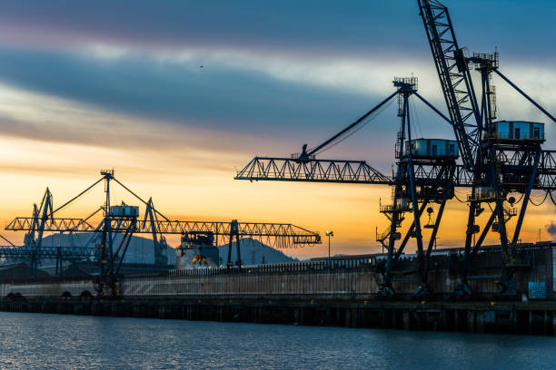 istock sunrise view to Bilbao industrial cranes, spain 825447532