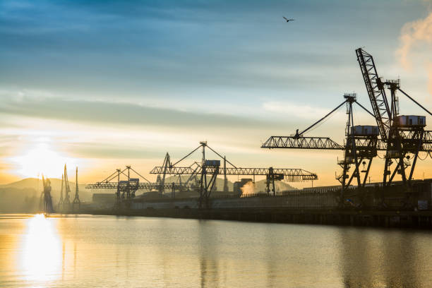 istock sunrise view to Bilbao industrial cranes, spain 825447644