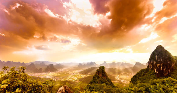 istock Dramatic sunset over karst landscape from moon hill in yangshuo 825451002