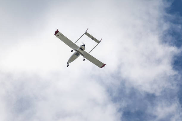 istock Unmanned aerial vehicle (UAV) in blue sky. 825461812