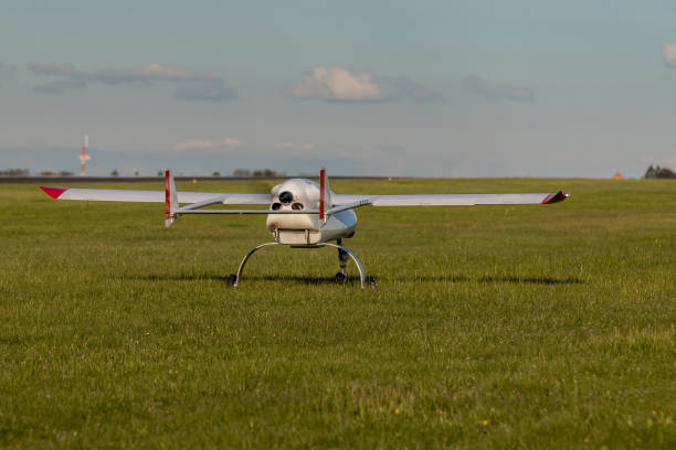 istock Unmanned aerial vehicle (UAV) on grass runway. 825461882