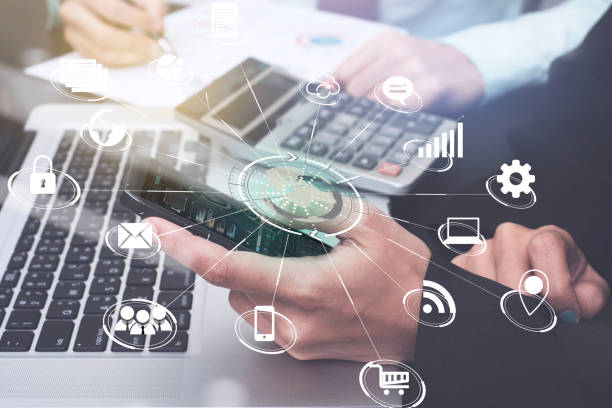 istock business using smart phone application global marketing on desk office with technology virtual icons interface. 825464054
