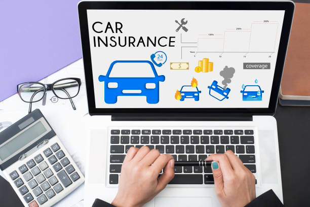 business hand using computer with car insurance policy page. concept accident prevention coverage. stock photo