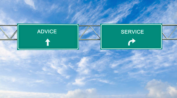 istock Direction road sign with  words advice and service 825465260