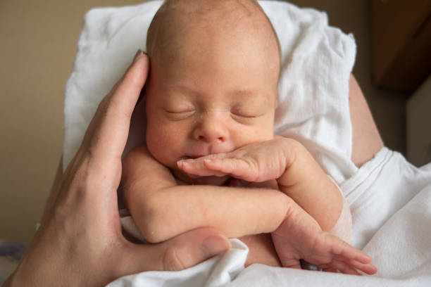 istock Baby on mother's hands 825469412