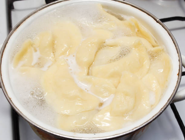 istock Vareniki with potatoes are cooked in a saucepan 825473000