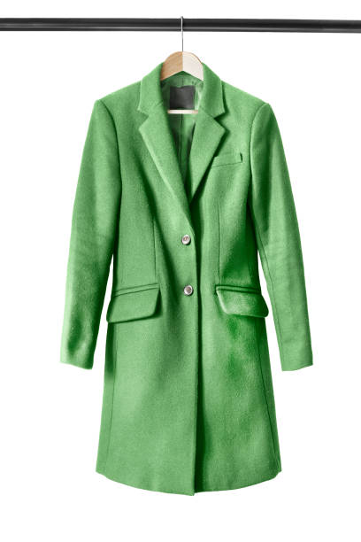 Coat on clothes rack Green wool coat on wooden clothes rack isolated over white coat wool button clothing stock pictures, royalty-free photos & images