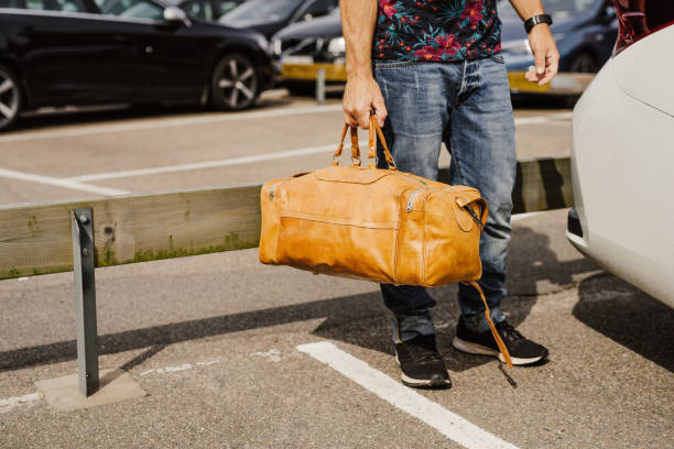 istock Man carrying bags and luggage 825478092
