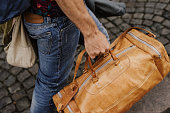 Man carrying bags and luggage