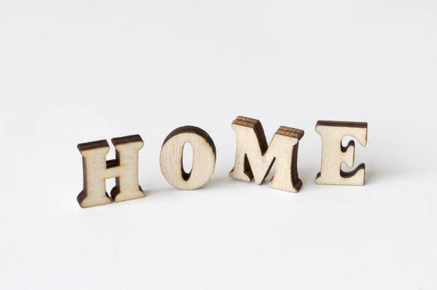 istock home, Wood letters HOME on White background 825478634
