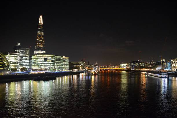 istock The Shard skyscraper and river Thames by night, London, UK 825482200