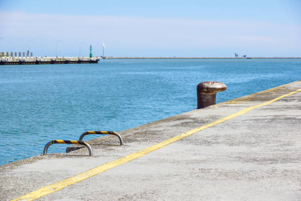 Concrete pier like quay with mooring sides .