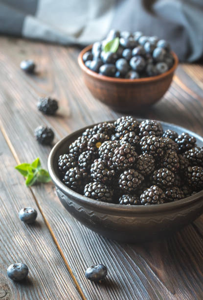 istock Bowls of blackberries and blueberries 825489720