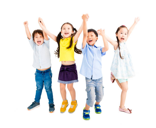 istock Group of happy  kids jumping and dancing 825502340