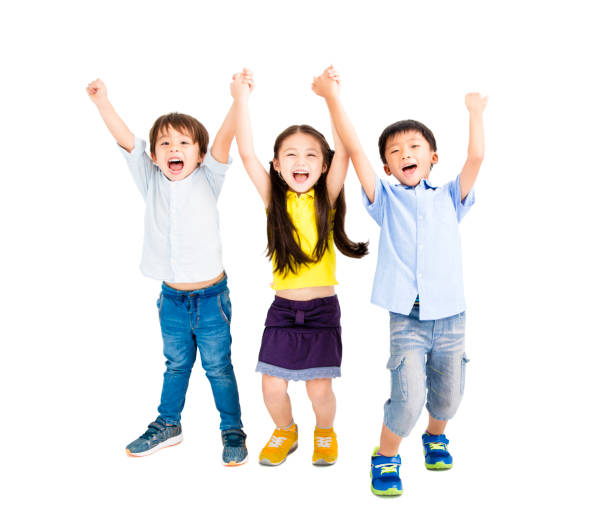 istock Group of happy smiling kids raise hands 825505430