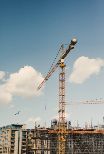 istock Building cranes outdoors with new houses being developed 825506336