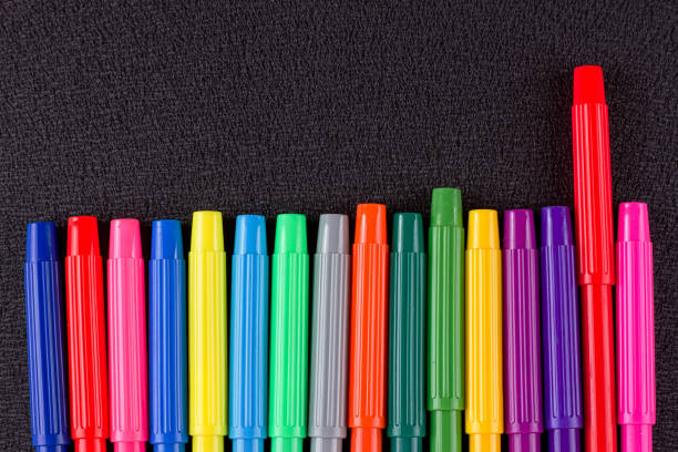 istock Color pencils on black background 825509290