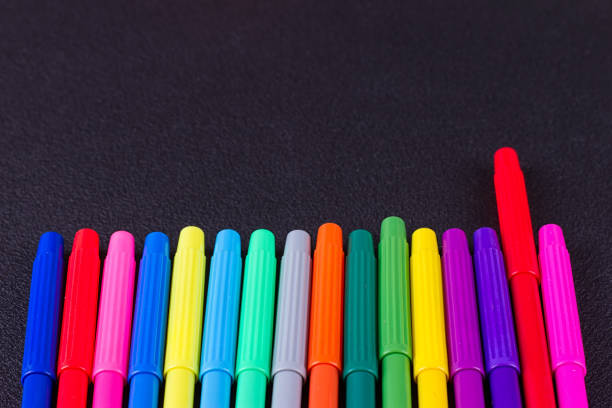 istock Color pencils on black background 825509446