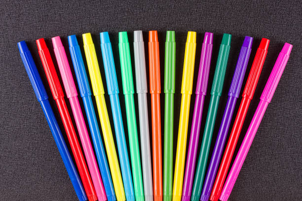 istock Color pencils on black background 825509590