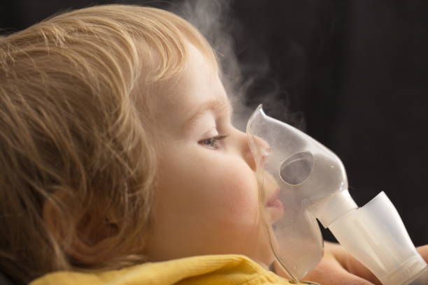 Inhalation child infant under one year Inhalation child infant under one year pediatric nebulizer mask stock pictures, royalty-free photos & images
