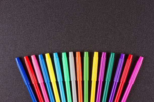 istock Color pencils on black background 825509738