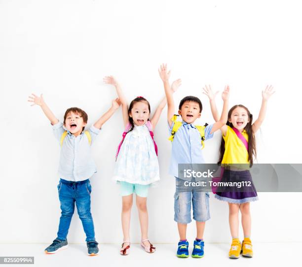 Group Of Happy Smiling Kids Raise Hands Stock Photo - Download Image Now - Child, Elementary Student, Backpack