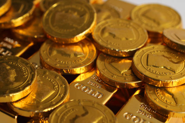 istock Gold coins with gold ingot 825522082