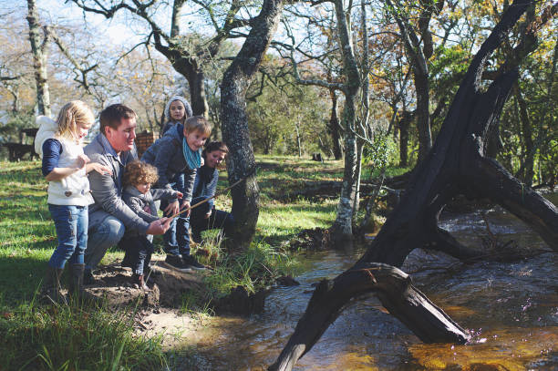istock Family at flowing stream 825522274