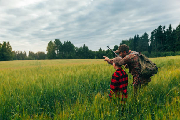 istock Father and Son hunting for boar 825522556